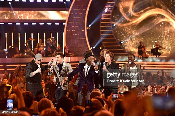 Singers Ben Briley, Alex Preston, Dexter Roberts, Aloe Blacc, Sam Woolf, Caleb Johnson, and C.J. Harris perform during Fox's "American Idol" XIII...