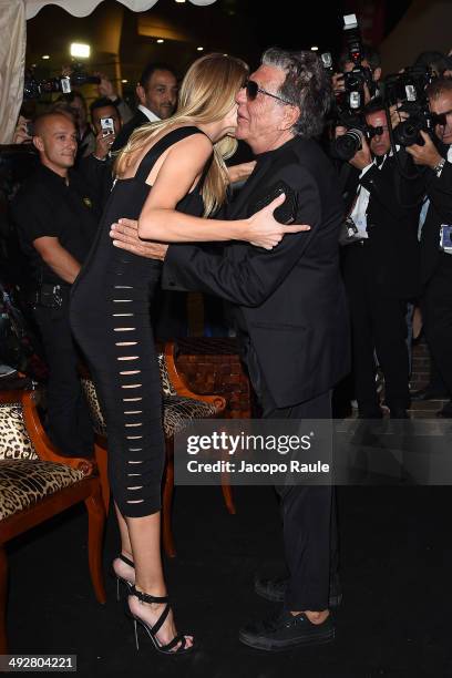 Rosie Huntington-Whiteley and Roberto Cavalli attend the "Roberto Cavalli Annual Party Aboard" : Outside Arrivals at the 67th Annual Cannes Film...