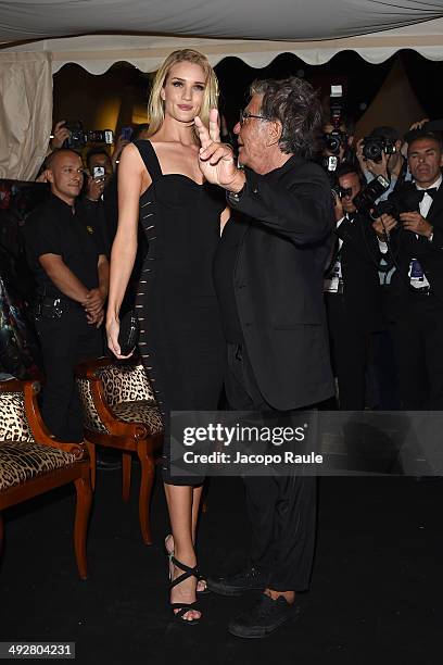 Rosie Huntington-Whiteley and Roberto Cavalli attend the "Roberto Cavalli Annual Party Aboard" : Outside Arrivals at the 67th Annual Cannes Film...