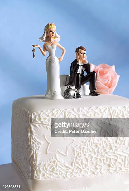 married couple with ball and chain - couple trapped stock pictures, royalty-free photos & images