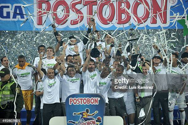 The players of Atletico Nacional lift the trophy as champions of the Liga Postobon I 2014 after defeat Atletico Junior during a second leg match...
