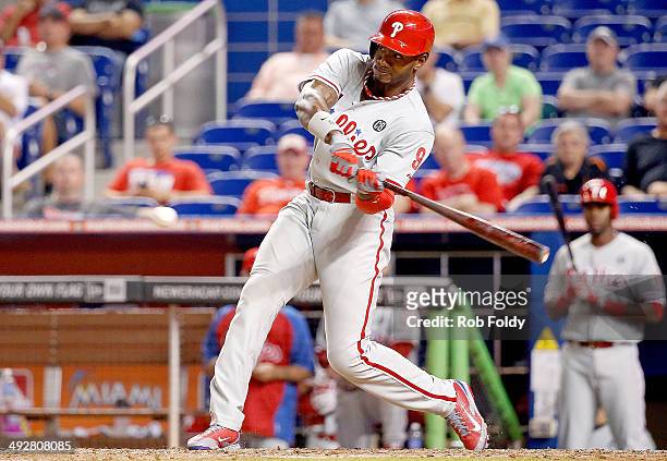 Domonic Brown of the Philadelphia Phillies hits a home run during the eighth inning of the game against the Miami Marlins at Marlins Park on May 21,...