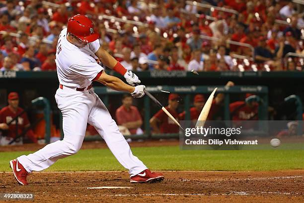 Mark Ellis of the St. Louis Cardinals breaks his bat wile batting against the Arizona Diamondbacks in the ninth inning at Busch Stadium on May 21,...