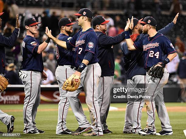 Minnesota Twins players high-five after defeating the San Diego Padres 2-0 in a baseball game at Petco Park May 21, 2014 in San Diego, California.