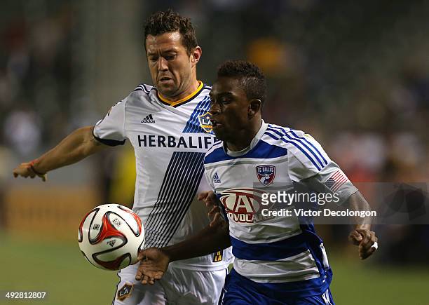 Fabian Castillo of FC Dallas and Dan Gargan of the Los Angeles Galaxy vie for the ball in the second half of their MLS match at StubHub Center on May...