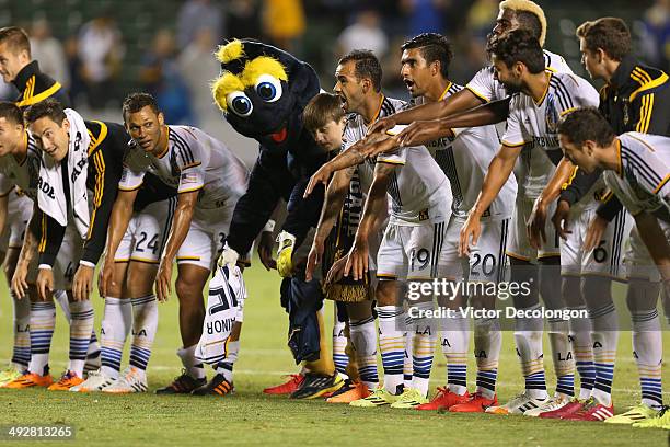 Members of the Los Angeles Galaxy applaud their fans after their MLS match against FC Dallas at StubHub Center on May 21, 2014 in Los Angeles,...