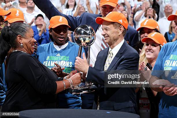 President Laurel J. Richie presents Minnesota Lynx owner Glen Taylor the WNBA trophy after the Lynx defeat the Indiana Fever in Game 5 of the 2015...