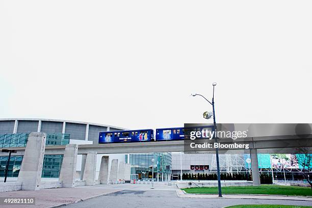 The Detroit People Mover passes in front of the COBO Center in downtown Detroit, Michigan, U.S., on Sunday, Oct. 4, 2015. Ten months after emerging...