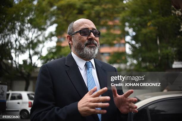 The lawyer of former Guatemalan President Otto Perez Molina, Moises Galindo, speaks with journalits after handing over a letter to Ecuador President...