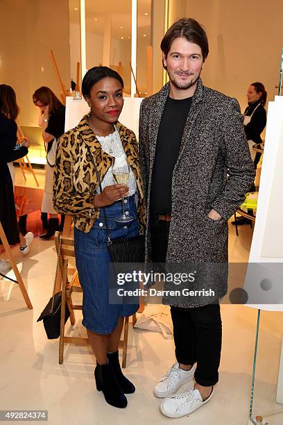 Jordan Wallace and Patrick Boiteaud attend the Christopher Kane Art Class 2015 at Christopher Kane Flagship 6-7 Mount Street on October 15, 2015 in...