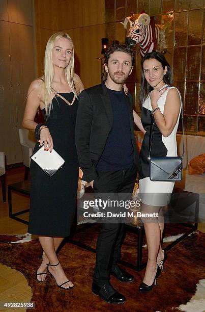 Virginie Courtin Clarins, David Korma and Sandrine Groslier attend the Frieze Dinner hosted by Mugler for their handbag line launch at Rosewood...