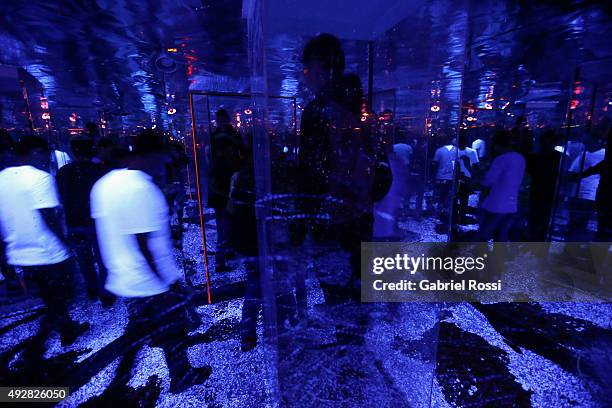 Visitors interact with Habitación octogonal de espejos room during La Menesunda show, an installation by Argentine artist Marta Minujin at Buenos...