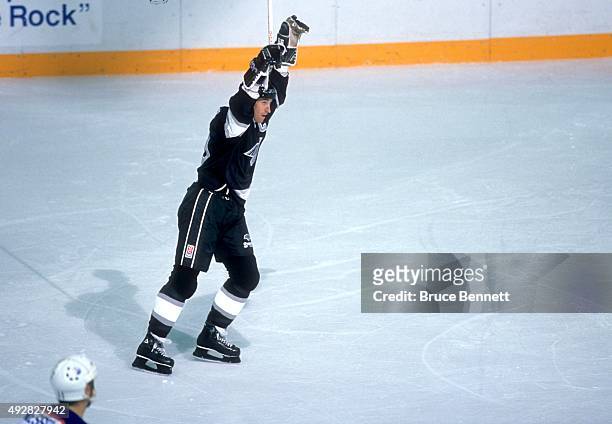 Wayne Gretzky of the Los Angeles Kings celebrates after the Kings scored and Gretzky tied Gordie Howes record with his 1850th career NHL point...