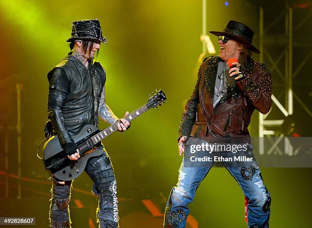 Guitarist Dj Ashba and singer Axl Rose of Guns N' Roses perform at The Joint inside the Hard Rock Hotel & Casino during the opening night of the...