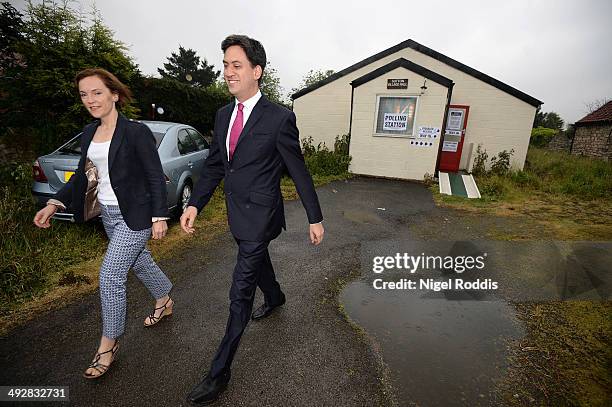 Labour leader Ed Miliband, and his wife Justine, leave after voting in the Local and European elections at Sutton Village Hall on May 22, 2014 in...