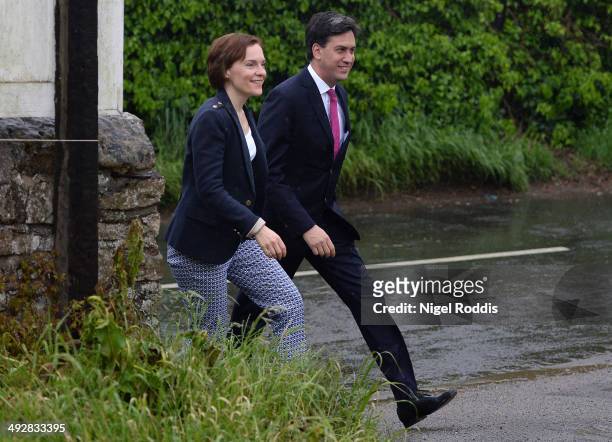 Labour leader Ed Miliband, and his wife Justine, leave arrive to vote in the Local and European elections at Sutton Village Hall on May 22, 2014 in...