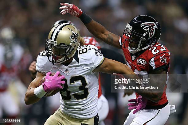 Willie Snead of the New Orleans Saints is brought down by Robert Alford of the Atlanta Falcons during the first quarter of a game at the...