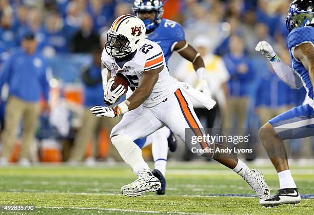 Peyton Barber of the Auburn Tigers runs with the ball against the Kentucky Wildcats at Commonwealth Stadium on October 15, 2015 in Lexington,...