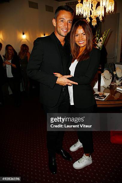 Presenters Stephane Jobert and Karine Arsene attends the Stella & Dot Cocktail Party To Benefit "Octobre Rose" on October 15, 2015 in Paris, France.