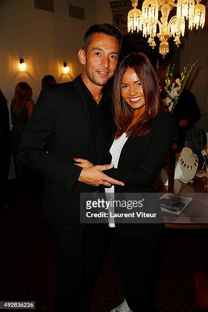Presenters Stephane Jobert and Karine Arsene attends the Stella & Dot Cocktail Party To Benefit "Octobre Rose" on October 15, 2015 in Paris, France.