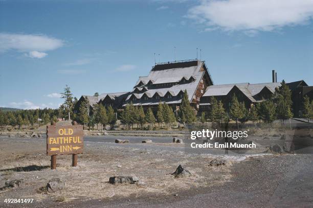 The Old Faithful Inn in Yellowstone National Park, Wyoming, USA, circa 1965. It provides a view of the Old Faithful geyser.