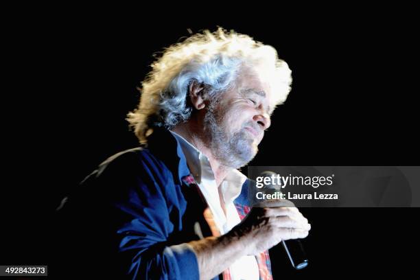 Beppe Grillo, Italian comedian, blogger and political leader of the Movimento 5 Stelle , greets people after speaking during a political rally before...