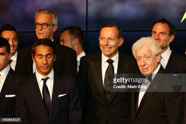 David Gallop, Prime Minister of Australia Tony Abbott and FFA Chairman Frank Lowy pose with the Australian Socceroos during the Australian Socceroos...