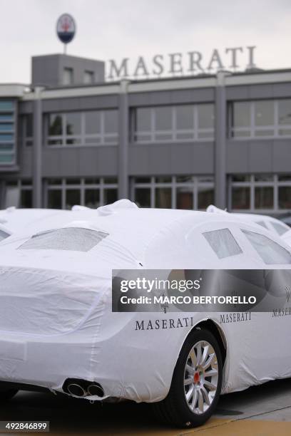 Several Maserati Quattroporte are parked outside a Maserati plant on May 22, 2014 in Grugliasco, near Turin. The plant was renamed after late Italian...