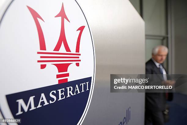 The logo of Italian luxury car manufacturer Maserati is seen at the entrance of a Maserati plant on May 22, 2014 in Grugliasco, near Turin. The...