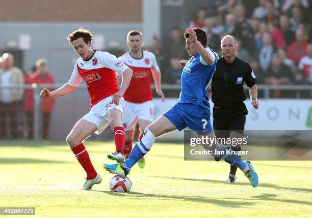 Josh Morris of Fleetwood Town is challenged by Michael Coulson of York City during the Sky Bet League Two play off Semi Final second leg match...