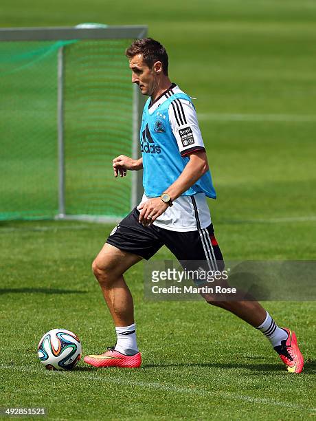 Miroslav Klose runs with the ball during the German National team training session at St.Martin training ground on May 22, 2014 in St.Martin in...