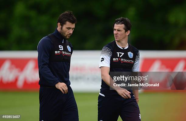 Charlie Austin and Joey Barton of Queens Park Rangers look on during a Queens Park Rangers training session on May 22, 2014 in Harlington, England.