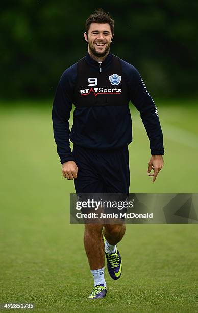 Charlie Austin of Queens Park Rangers warms up during a Queens Park Rangers training session on May 22, 2014 in Harlington, England.