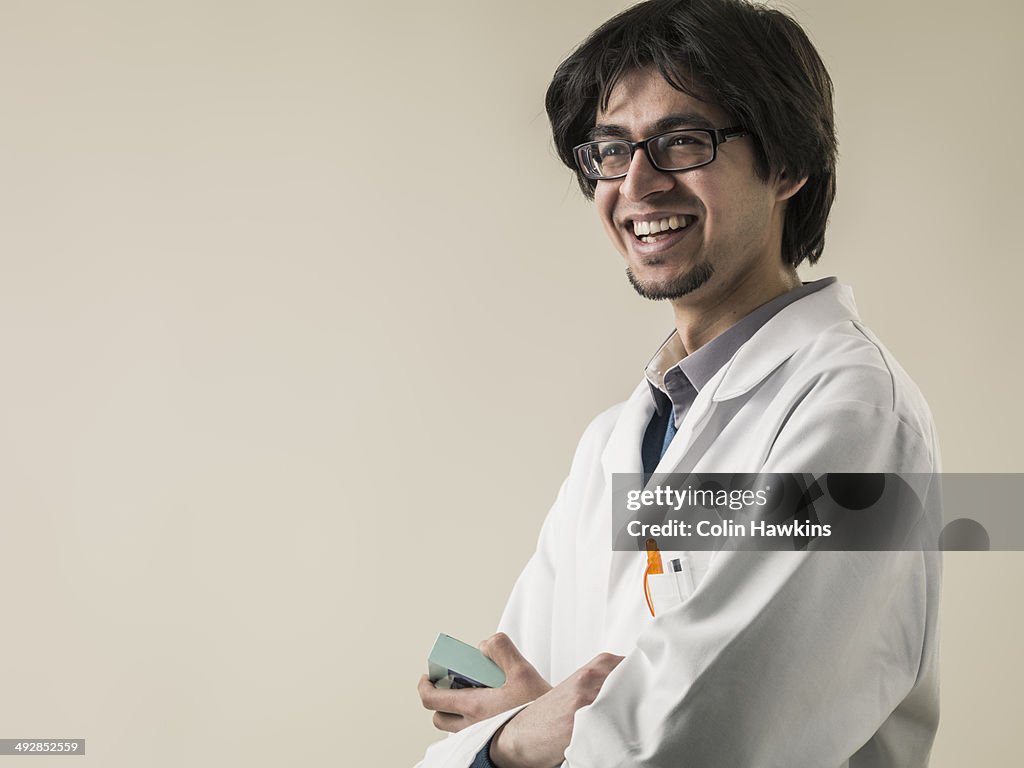 Asian pharmacist wearing laboratory coat