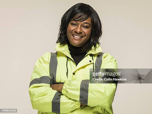 black woman wearing high visibilty jacket - paramedic portrait stock pictures, royalty-free photos & images