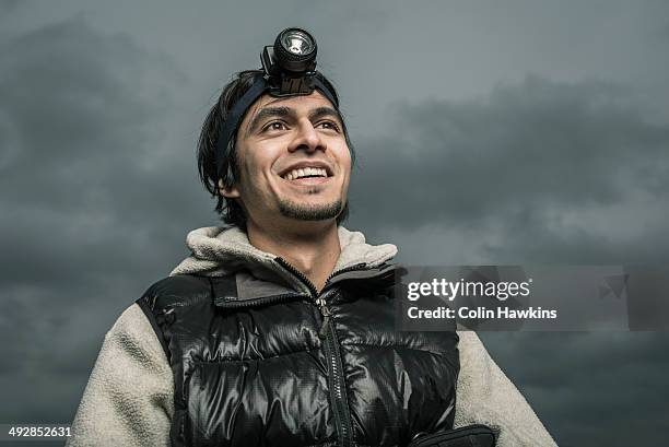 asian male outside wearing head torch - headlamp stock pictures, royalty-free photos & images