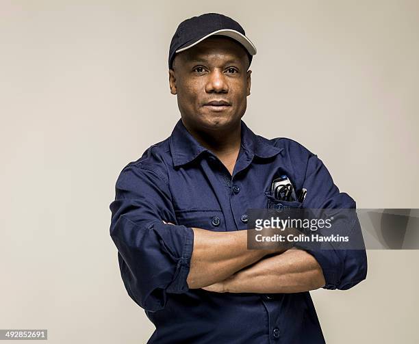 black male in work clothes - repairman photos et images de collection
