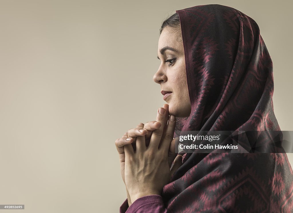 Portrait of young woman wearing hijab head scarf