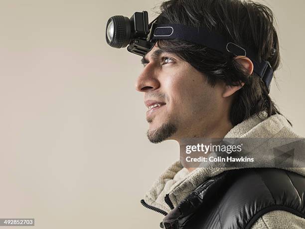 asian man wearing head torch - head torch stock pictures, royalty-free photos & images