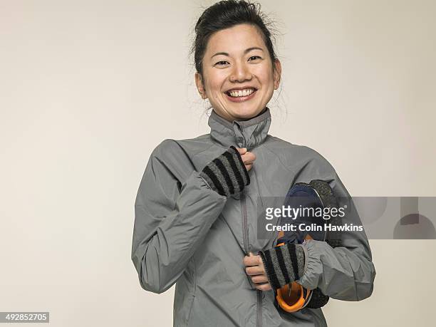 southeast asian woman with sports wear - gray glove stock-fotos und bilder