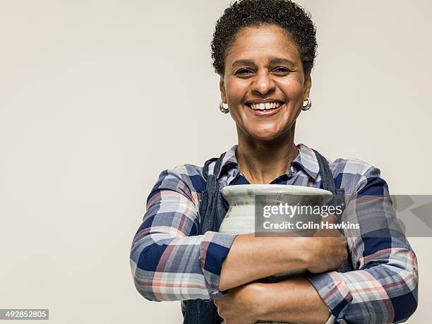 black woman with hand crafted pottery vase - object stock pictures, royalty-free photos & images