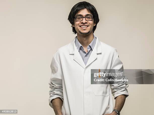 asian man wearing laboratory coat - lab coat fotografías e imágenes de stock