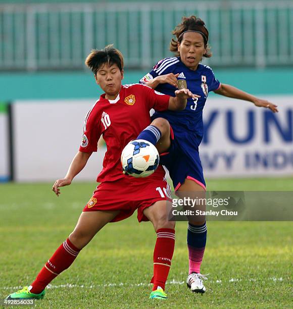 Li Ying of China battles with Azusa Iwashimizu of Japan during the AFC Women's Asian Cup Semi Final match between Japan and China at Thong Nhat...