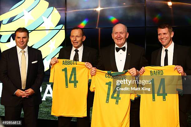 Socceroos Head Coach Ange Postecoglou presents Socceroos jerseys to Prime Minister of Australia Tony Abbott, Governor-General of Australia Peter...