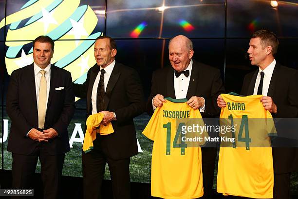 Socceroos Head Coach Ange Postecoglou presents Socceroos jerseys to Prime Minister of Australia Tony Abbott, Governor-General of Australia Peter...