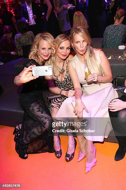 Designer Sonja Kiefer, Regina Halmich and Monica Ivancan are doing a selfie during the Tribute to Bambi 2015 after show party at Station on October...
