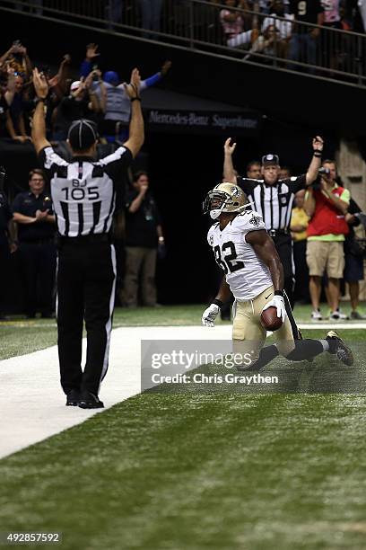 Benjamin Watson of the New Orleans Saints scores a touchdown during the third quarter of a game against the Atlanta Falcons at the Mercedes-Benz...