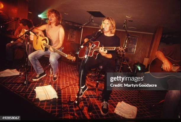 Def Leppard perform an acoustic show at Wapentake Club, Sheffield, United Kingdom, 5th October 1995. L-R Rick Savage and Joe Elliott .