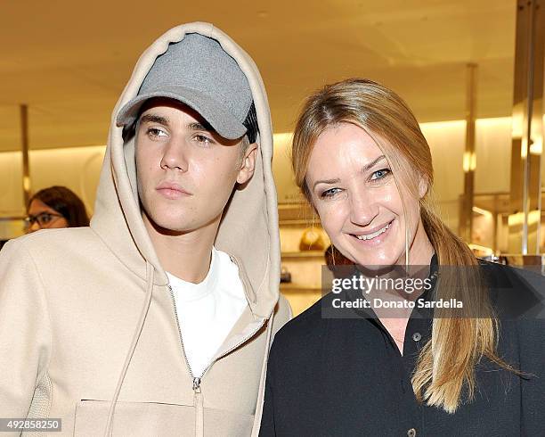 Singer Justin Bieber and designer Anya Hindmarch attends The Anya Hindmarch Service Station Collection hosted by Barneys New York along with Jena...