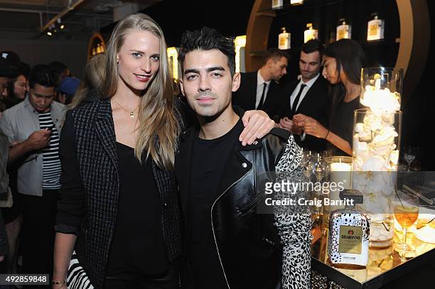 Model Julie Henderson and singer Joe Jonas attend the Disaronno Wears Cavalli global launch event on October 15, 2015 at Milk Studios in New York...